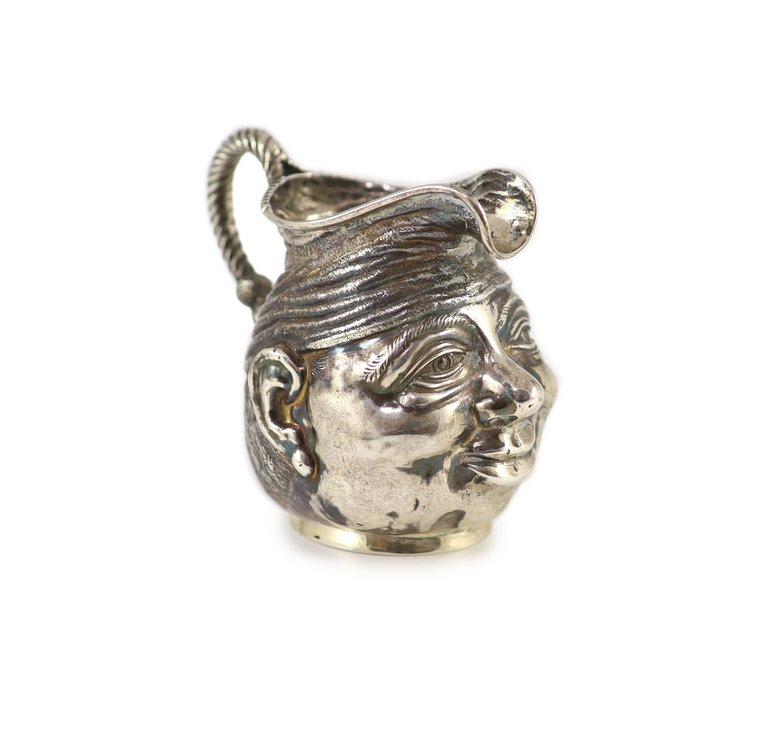 An Edwardian novelty silver cream jug, modelled as a gentleman's head with turban?, Williams, Birmingham, Ltd